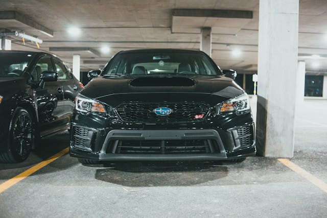 black car parked in a parking space