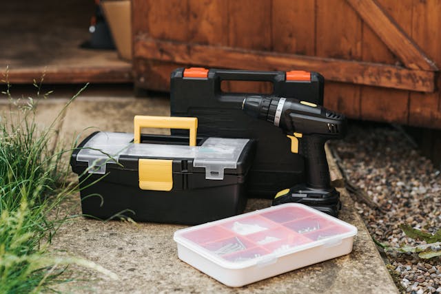 toolboxes set on a concrete pathway